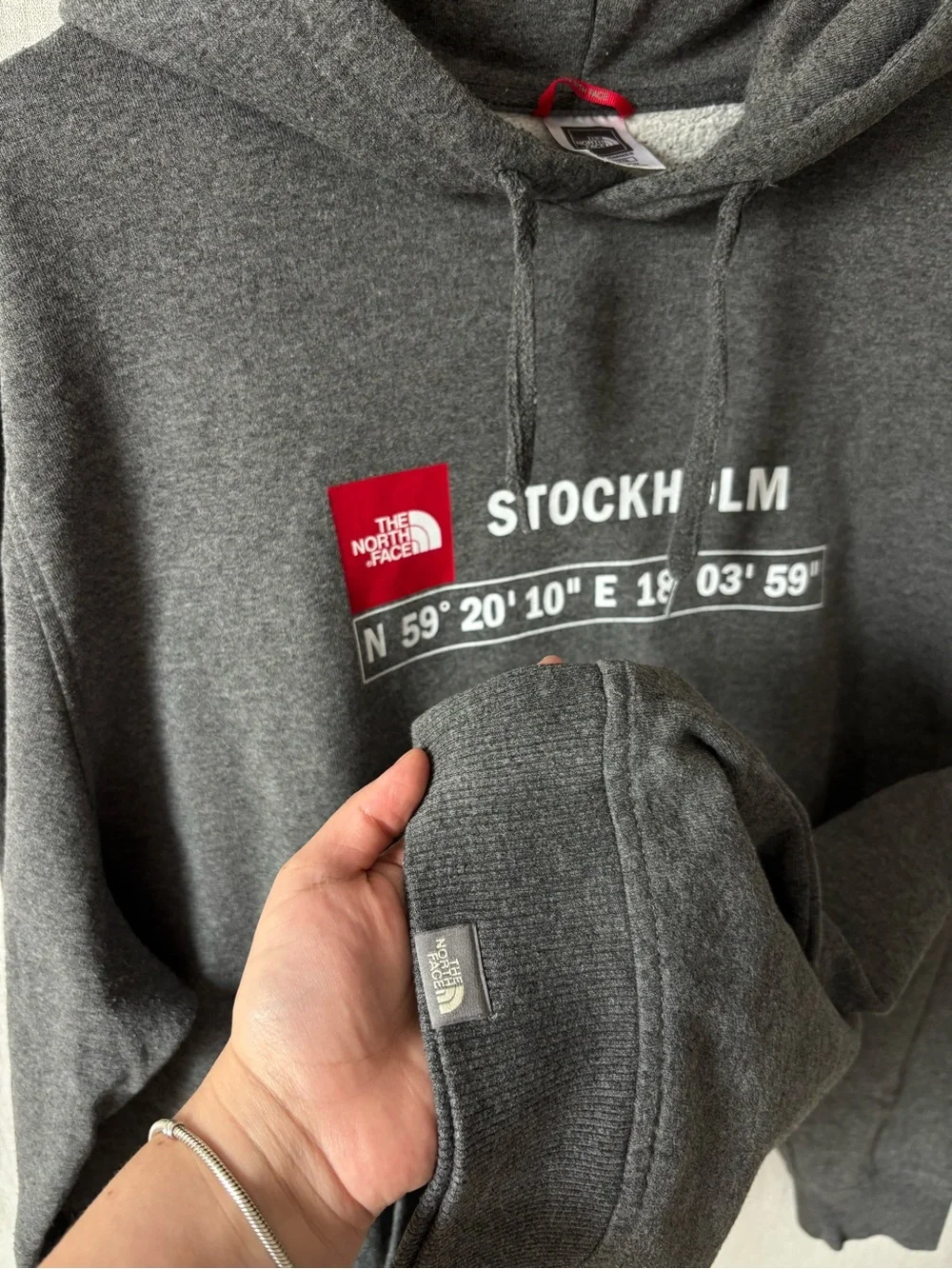 The North Face Men’s Stockholm Hoodie in Charcoal Gray with Red Logo